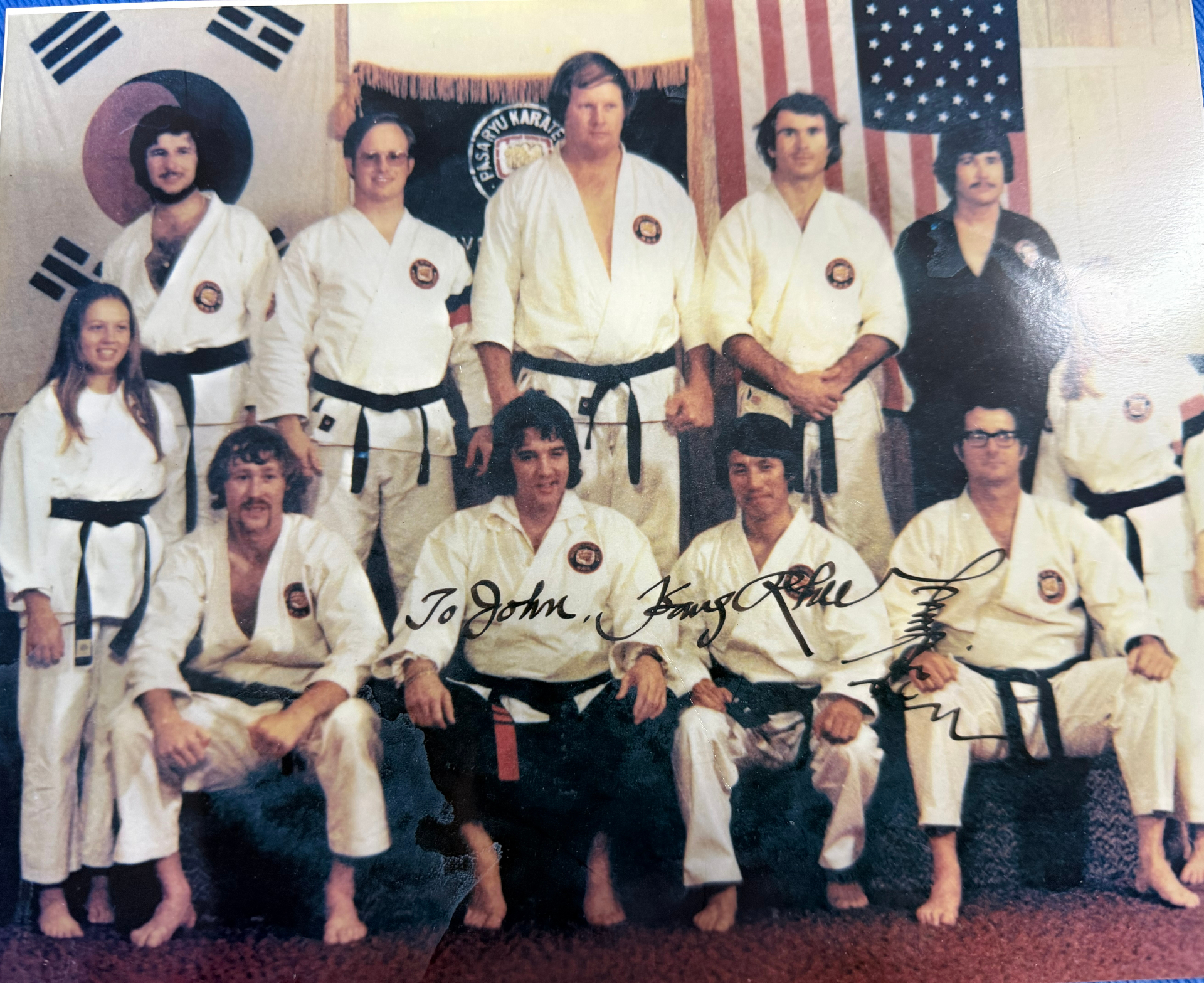 Vintage signed group photo from Grandmaster Kang Rhee's Pasaryu Karate school, dedicated to John Gill