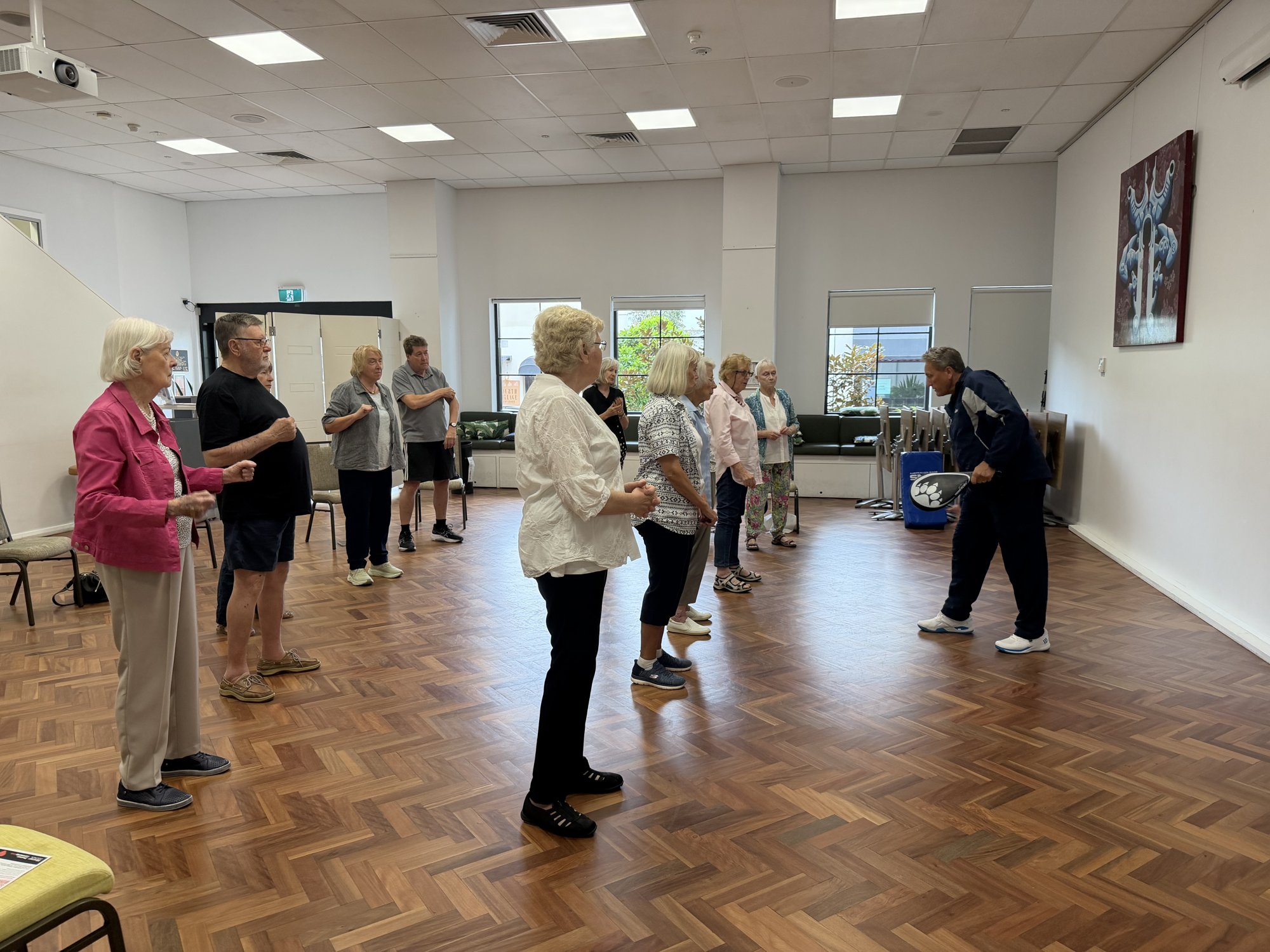 Grandmaster demonstrating a wrist-grab escape at a S.A.F.E. community seminar